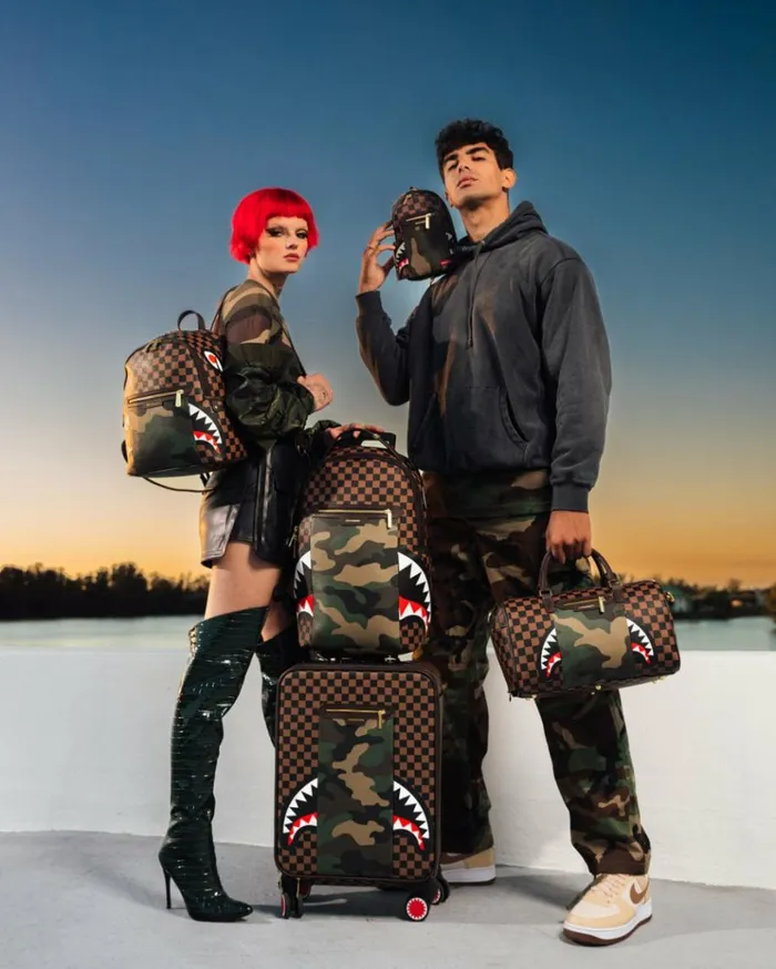 SPRAYGROUND EXTERIOR GOLD ZIP POCKET SHARKS IN PARIS MINI DUFFLE Bags